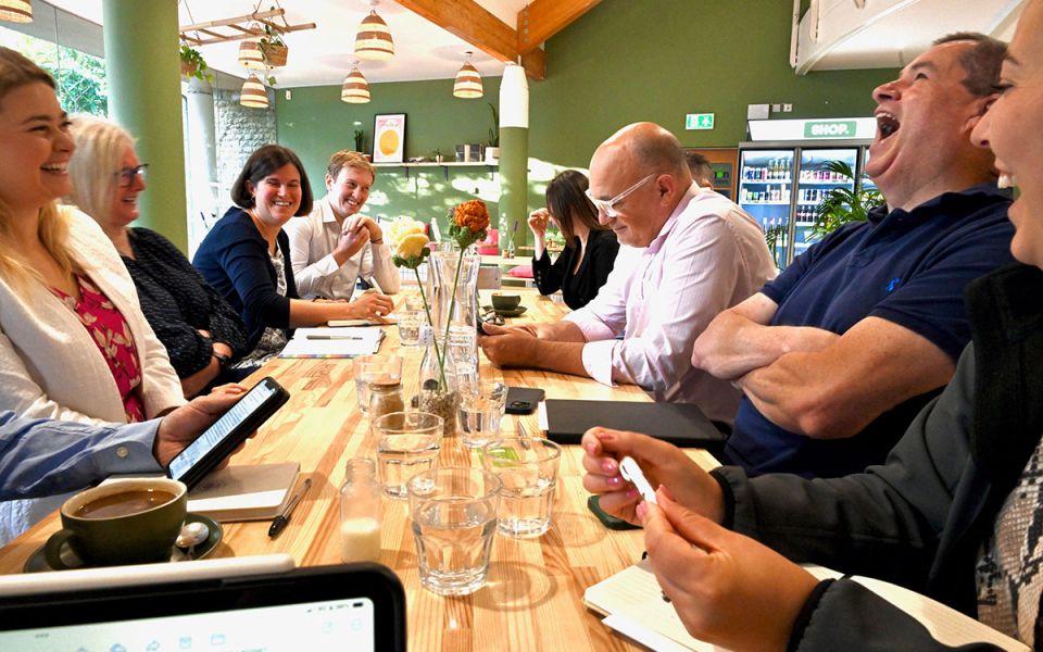 members laughing at networking event